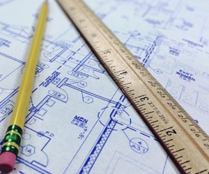ruler and pencil sitting on a blueprint